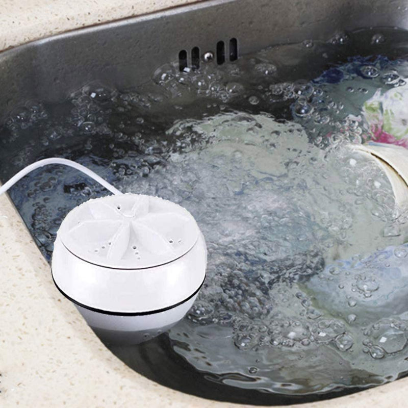 White electronic device with a hose submerged in water, likely for cleaning or rinsing purposes.